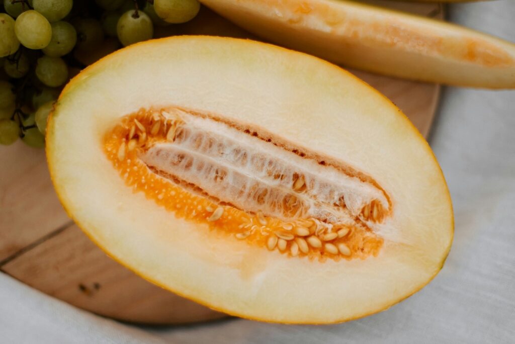Peeling the skin off a loofah gourd